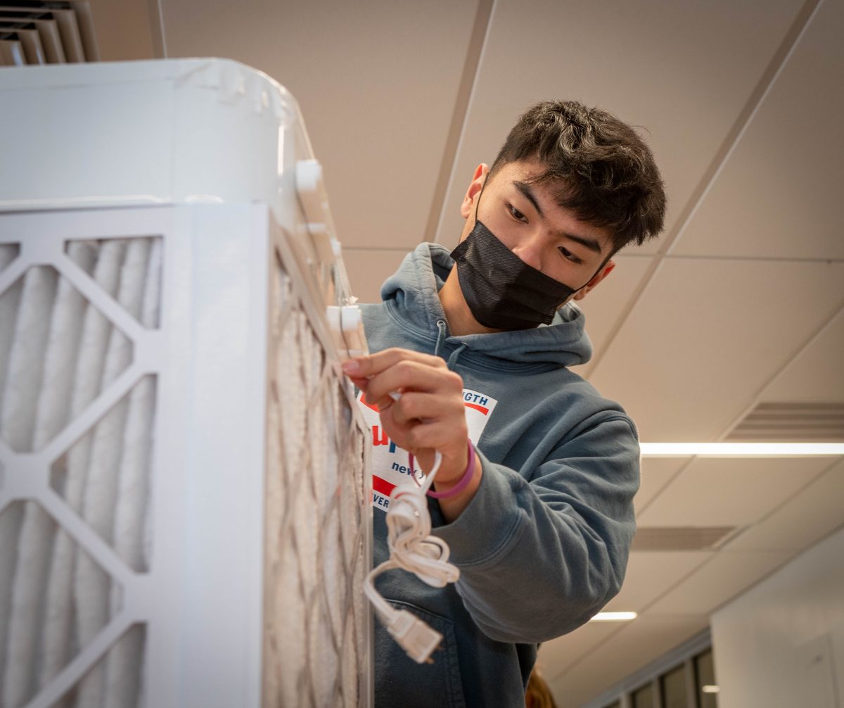 student preparing a air filter